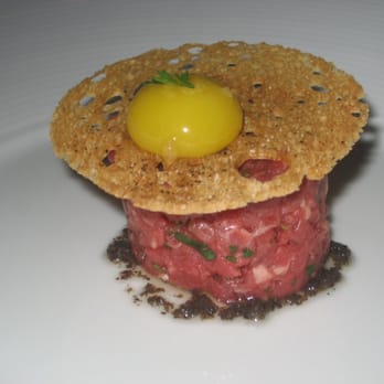 Acquerello - Chopped beef tartare with Parmesan cream, quail egg and truffle drizzle - Italian Near Me - San Francisco, California Acquerello - Chopped beef tartare with Parmesan cream, quail egg and truffle drizzle - Italian Near Me - San Francisco, California
