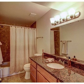 Poplin Construction - a bathroom with a sink, toilet, and shower - General Contractors Near Me - Tucson, Arizona Poplin Construction - a bathroom with a sink, toilet, and shower - General Contractors Near Me - Tucson, Arizona