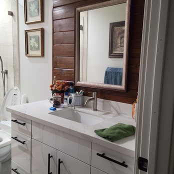 Hoang Construction - a bathroom with a sink, toilet, and shower - General Contractors Near Me Hoang Construction - a bathroom with a sink, toilet, and shower - General Contractors Near Me