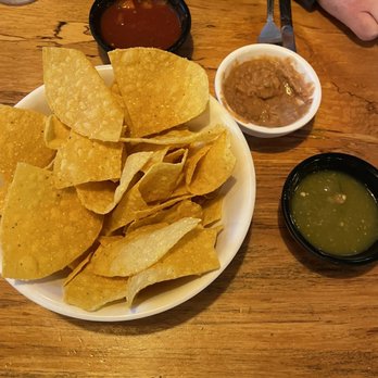 Mezcalitos Mexican Restaurant - Complimentary chips, red salsa, and refried beans. We requested verde salsa and they happily obliged. - Mexican Near Me - Poulsbo, Washington