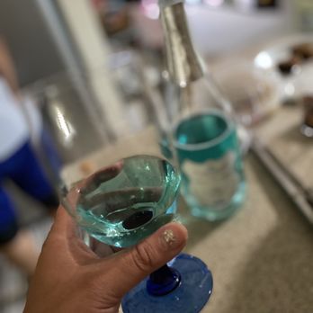Suisun Valley Filling Station - a person holding a glass of water - Wine Bars Near Me - Fairfield, California Suisun Valley Filling Station - a person holding a glass of water - Wine Bars Near Me - Fairfield, California