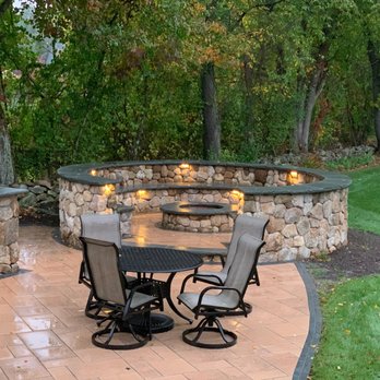 Madrona Brothers - a patio with a fire pit - Lawn Services Near Me - Framingham, Massachusetts Madrona Brothers - a patio with a fire pit - Lawn Services Near Me - Framingham, Massachusetts