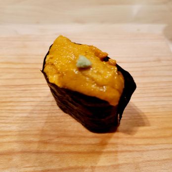 Good Sushi - a piece of sushi on a cutting board - Sushi Bars Near Me - Lincolnshire, Illinois Good Sushi - a piece of sushi on a cutting board - Sushi Bars Near Me - Lincolnshire, Illinois
