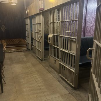 Antagonist Cafe - 3 jail cells with tables to enjoy your food and drinks - Desserts Near Me - St. Louis, Missouri