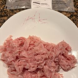 Ham and slices of plastic along with packaging