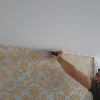Popcorn Ceiling Solution - a man painting a wall - Interior Design Near Me Popcorn Ceiling Solution - a man painting a wall - Interior Design Near Me