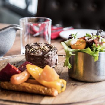 L'Aurochs - a plate of food on a table - Steakhouses Near Me - Brossard, Quebec