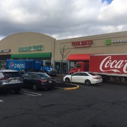 The delivery trucks create a very dangerous situation for pedestrians and drivers.
