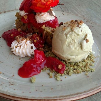 Driftwood Kitchen - This strawberry pistachio cake was amazing! The flower was edible too. - Seafood Near Me - Laguna Beach, California