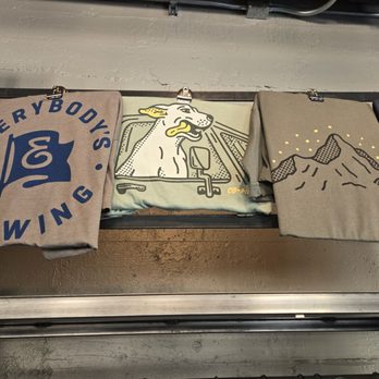 Everybody's Brewing - Dogs who aren't allowed on their premises but are used to sell shirts. - Brewpubs Near Me - White Salmon, Washington Everybody's Brewing - Dogs who aren't allowed on their premises but are used to sell shirts. - Brewpubs Near Me - White Salmon, Washington