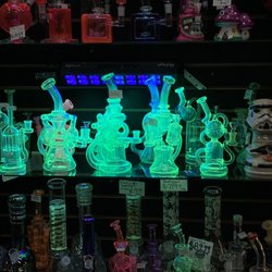 Third I Smoke Shop - Black light bongs / glass is stained neon green too.