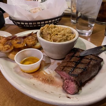 Texas Roadhouse - Medium rare 8oz. Sirloin, grilled shrimp on two pieces of garlic rolls with drawn butter and seasoned rice - Steakhouses Near Me - Middletown, New York Texas Roadhouse - Medium rare 8oz. Sirloin, grilled shrimp on two pieces of garlic rolls with drawn butter and seasoned rice - Steakhouses Near Me - Middletown, New York