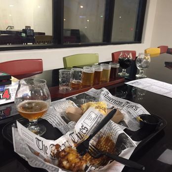 Thompson Brewing - The beers and food couldn't wait for a picture. !e tried every single beer they had on tap (all super good), chili tots, and the German brat - American Near Me - Riverside, California