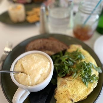 The Magnolia - The Forager Omelet with a side of corn grits - Breakfast & Brunch Near Me - Palatka, Florida The Magnolia - The Forager Omelet with a side of corn grits - Breakfast & Brunch Near Me - Palatka, Florida