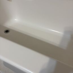 There's one light in the bathroom over the mirror. The light is blocking the shower. It's not a clean shower. There's one light in the bathroom over the mirror. The light is blocking the shower. It's not a clean shower.