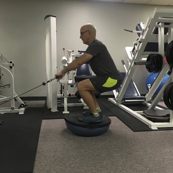 Ultimate Balanced Fitness - Bosu balance with seated rows. - Pilates Near Me - Houston, Texas Ultimate Balanced Fitness - Bosu balance with seated rows. - Pilates Near Me - Houston, Texas