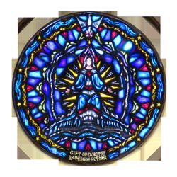 Star of the Sea Church - The stained glass window of Mary, Star of the Sea, above the altar inside Star of the Sea Church.