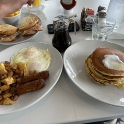 Maple - The logger: short stack pancakes, pork sausage, two eggs over easy, home fries. And behind is the turkey club ( outstanding )