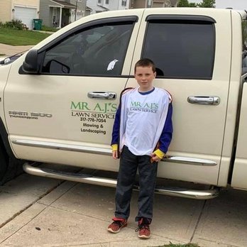 Mr. AJs Lawn Service - a boy standing in front of a truck - Lawn Services Near Me - Monrovia, Indiana Mr. AJs Lawn Service - a boy standing in front of a truck - Lawn Services Near Me - Monrovia, Indiana