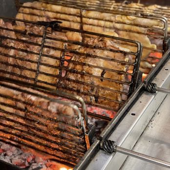 Colonia BBQ - a close up of a grill with meat on it - Portuguese Near Me - Colonia, New Jersey Colonia BBQ - a close up of a grill with meat on it - Portuguese Near Me - Colonia, New Jersey