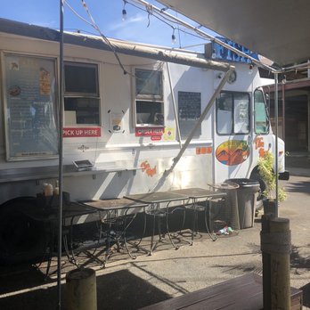 Fish Taqueria - a food truck parked under a tent - Mexican Near Me Fish Taqueria - a food truck parked under a tent - Mexican Near Me