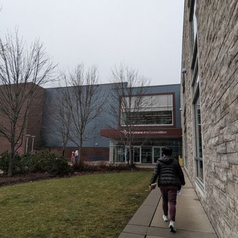 First Ontario Arts Centre - a person walking down a sidewalk - Music Venues Near Me - Milton, Ontario