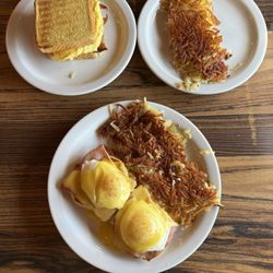 Ramblehorn Cafe - Breakfast sandwich with a side of hash browns (top) + traditional eggs benedict with hash browns