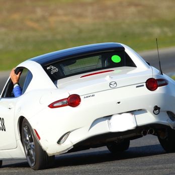 Thunderhill Raceway Park - Me holding on for dear life (or the A pillar) going around Turn 3 because the car is leaning so much. - Race Tracks Near Me - Willows, California
