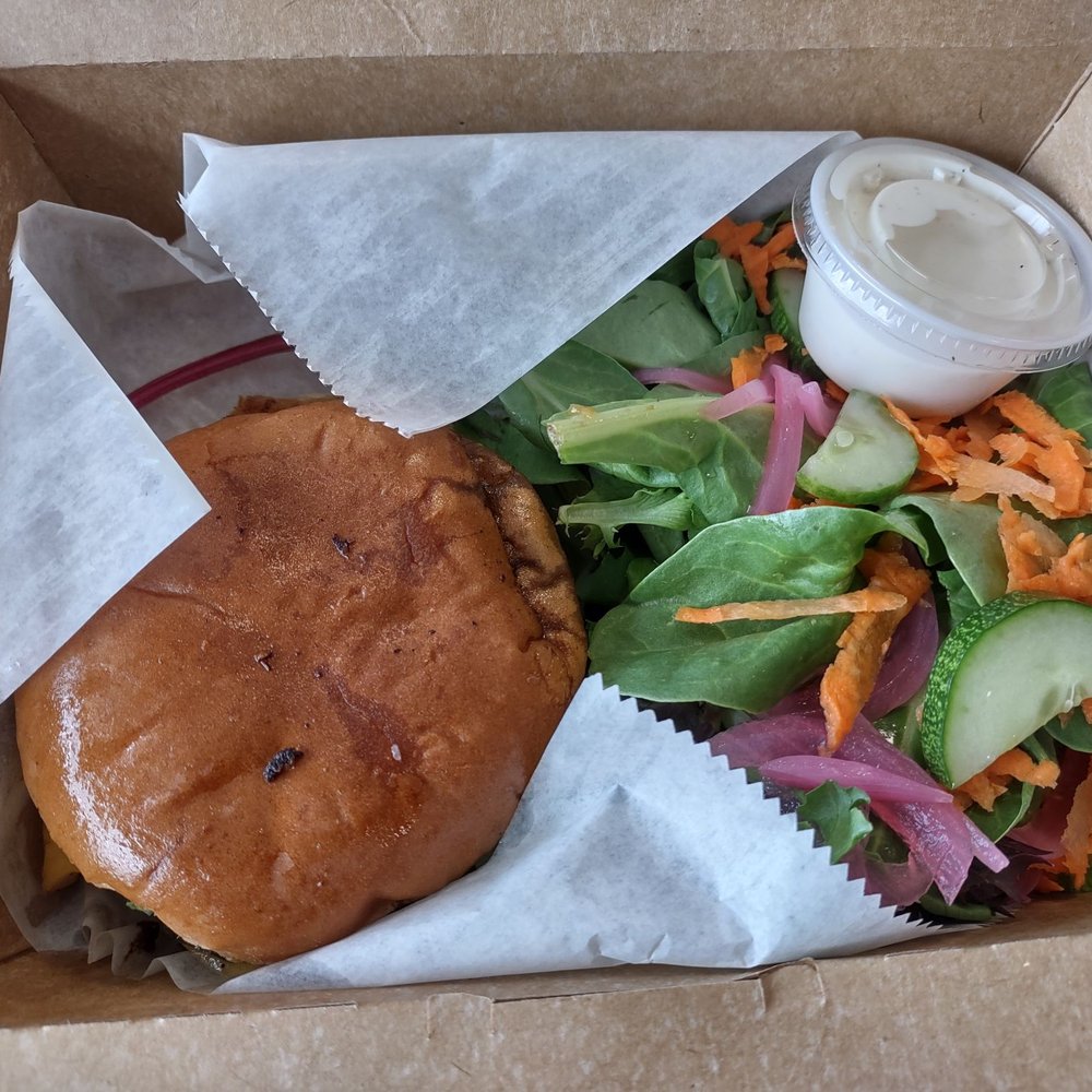 The Food Mill - Peach caprese burger with local beef, grilled peaches, fresh mozzarella and pesto and a side salad. - Community Service/Non-Profit Near Me - Columbus, Georgia