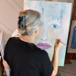 Dancing Coyote Gallery - Working on a painting in the gallery