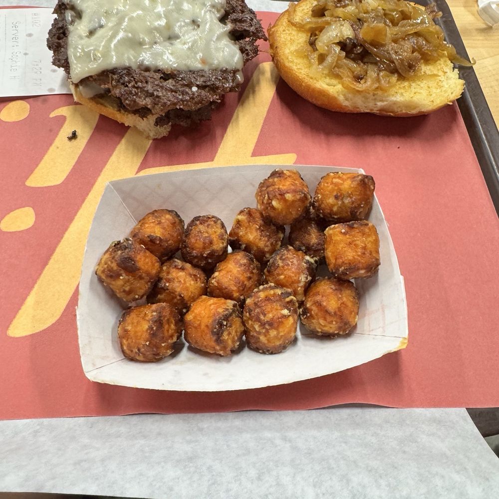 Double burger with sautéed onions and sweet potato fries Double burger with sautéed onions and sweet potato fries