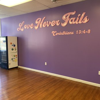 Love Made Edible - a purple wall with the words love never fails - Cupcakes Near Me - Brentwood, Pennsylvania Love Made Edible - a purple wall with the words love never fails - Cupcakes Near Me - Brentwood, Pennsylvania