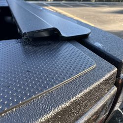 Shells Plus - Cover that goes on the end is missing. Tailgate trim is scratched so badly. It's going inwards more when it should sit flat and straight