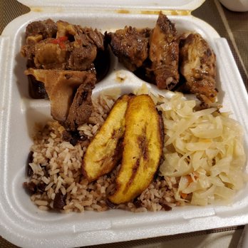 Mobay Cafe - Two meat dinner platter with braised oxtail & jerk chicken, rice and peas, fried ripe plantains, steamed cabbage - all delicious! - Cafes Near Me - Milwaukee, Wisconsin