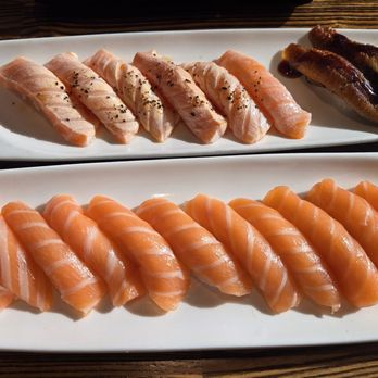 Takumi Sushi - Gorgeous picture taken by my gorgeous girlfriend in this gorgeous golden light. 12 salmon 6 pepper salmon 2 fresh water eel - Japanese Near Me - Costa Mesa, California