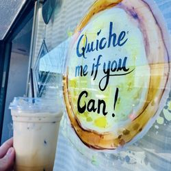 Quiche Me If You Can - Iced latte (2 shots) $5, +$.50 caramel flavor, + oat milk? I paid cash and didn't ask for receipt