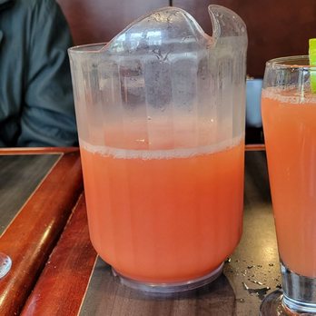 La Diable - three glasses of orange juice on a bar - American Near Me - Mont-Tremblant, Quebec La Diable - three glasses of orange juice on a bar - American Near Me - Mont-Tremblant, Quebec