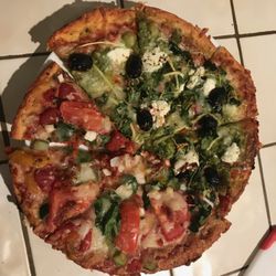 KT's Kitchen - Pizza - half tomato; half pesto on a cornmeal crust.