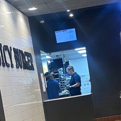 McDonald's - Both standing on phone while multiple people are waiting on their food.