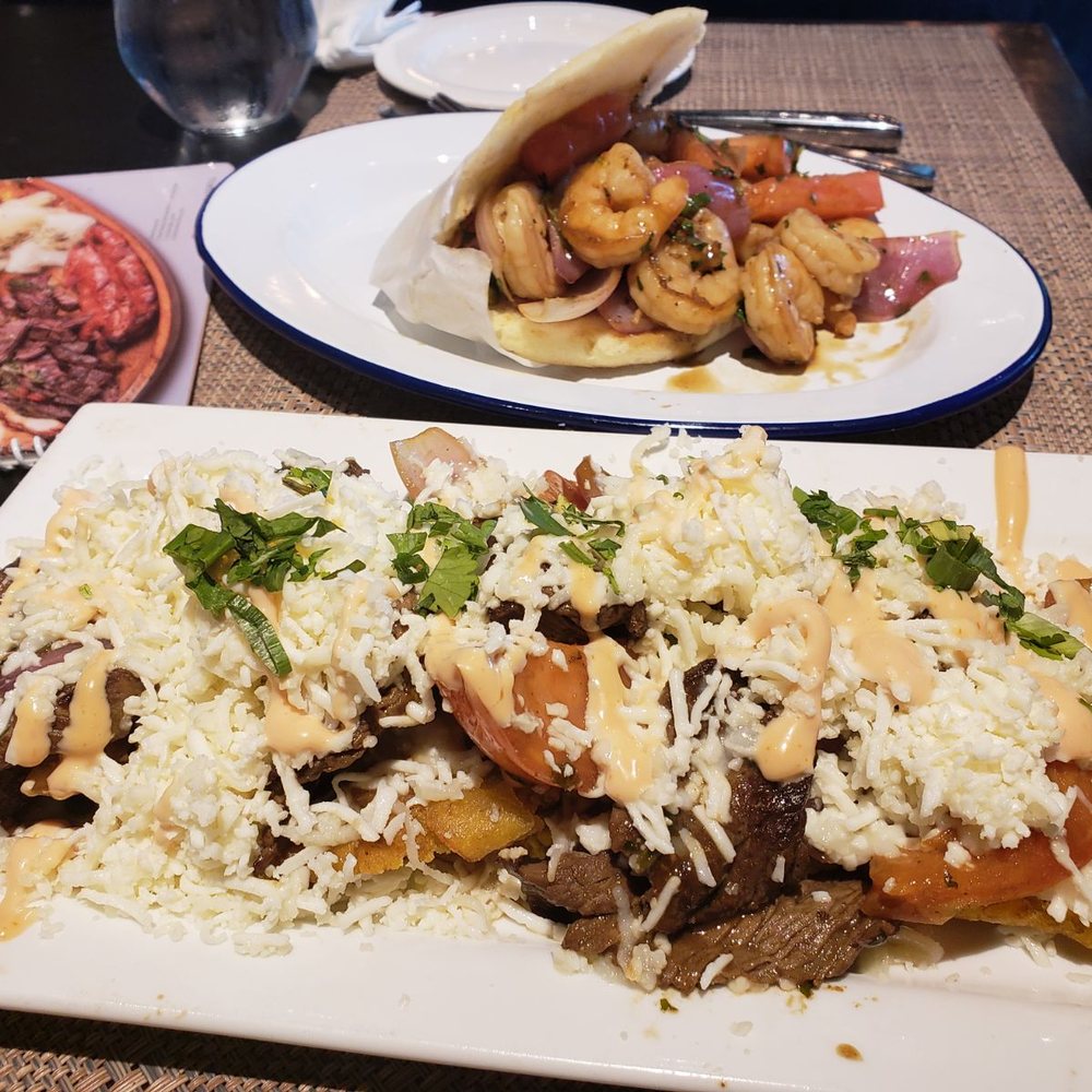 Bocas Grill Brickell - Shrimp Arepa and Tostones con Lomo Steak Saltado - Bars Near Me - Miami, Florida Bocas Grill Brickell - Shrimp Arepa and Tostones con Lomo Steak Saltado - Bars Near Me - Miami, Florida