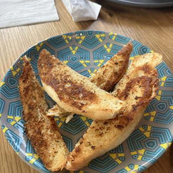 Nando's Peri-Peri - Garlic bread -- taste is good. Portions, no. Two of the pieces are like thin slices. But yes, delicious. - Portuguese Near Me - Richmond Hill, Ontario Nando's Peri-Peri - Garlic bread -- taste is good. Portions, no. Two of the pieces are like thin slices. But yes, delicious. - Portuguese Near Me - Richmond Hill, Ontario