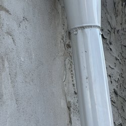 Creative Masonry & Waterproofing - Stucco behind pipe and did not cover true property line as indicated in our meeting