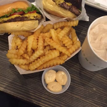 Shake Shack Harvard Square - Shackburger, Shack Stack, fries with a side of shack sauce and black and white shake - Burgers Near Me - Cambridge, Massachusetts