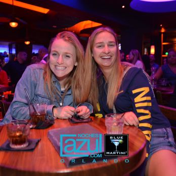 Noches Azul - two women sitting at a table - Dance Clubs Near Me - Orlando, Florida Noches Azul - two women sitting at a table - Dance Clubs Near Me - Orlando, Florida