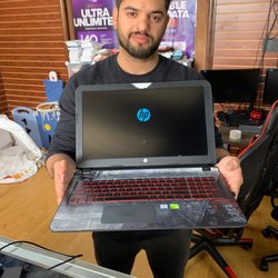Dr Digital - Ezequiel handing over my pc looking better than before he cleaned it up
