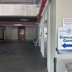 Global Entry Enrollment Center - It's the wooden door, looks like a closet, but there's a doorbell there.