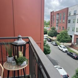The Village at Commonwealth - Take in the weather on a balcony