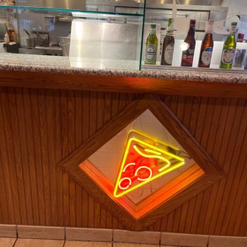 Tony's Pizza - a slice of pizza on a neon sign - Pizza Near Me - Raleigh, North Carolina Tony's Pizza - a slice of pizza on a neon sign - Pizza Near Me - Raleigh, North Carolina