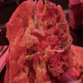 Redcoat Tavern - Cross section of their classic 1/2 pound burger. - Bars Near Me - Royal Oak, Michigan