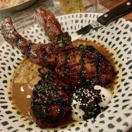 Korean spiced pork chops over kimchi polenta which was drowned in broth :( Korean spiced pork chops over kimchi polenta which was drowned in broth :(